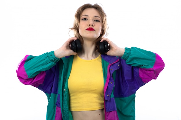 Free Photo | Beautiful young woman in colorful jacket and holding ...