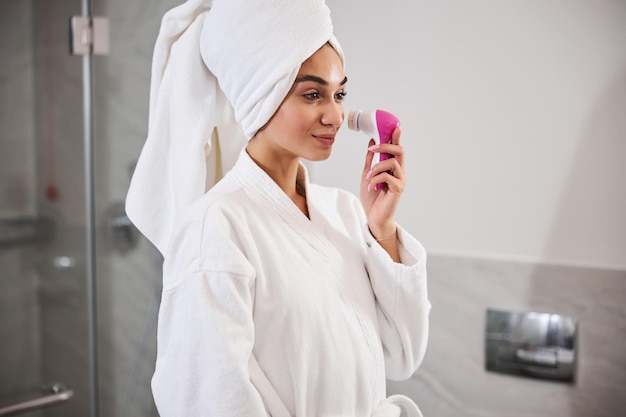 Premium Photo Beautiful Young Woman Doing Facial Massage After Shower