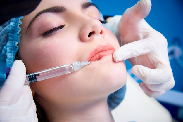 Beautiful Young Woman Gets Injection In Lips.beauty Injections And Cosmetology.plastic And Aesthetic