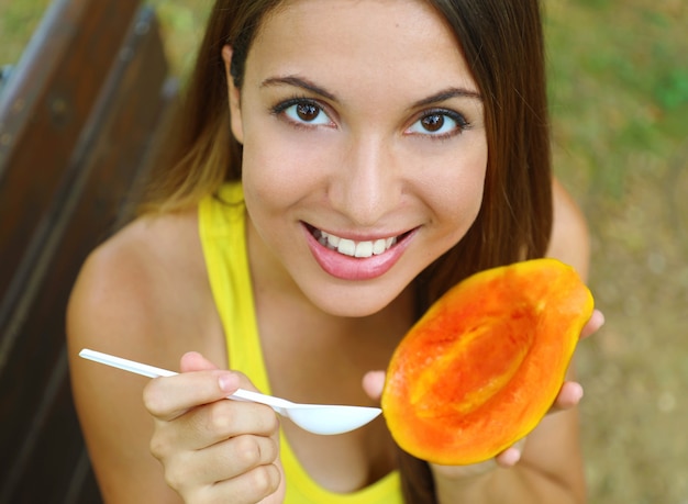 Premium Photo | Beautiful young woman holding papaya fruit