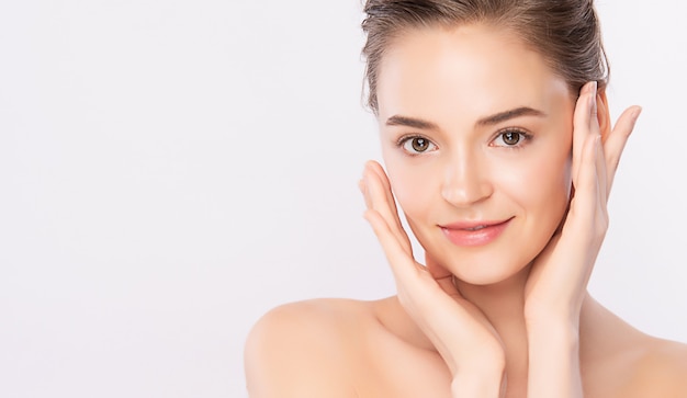 Premium Photo | Beautiful young woman touching her clean face with fresh  healthy skin, isolated on white