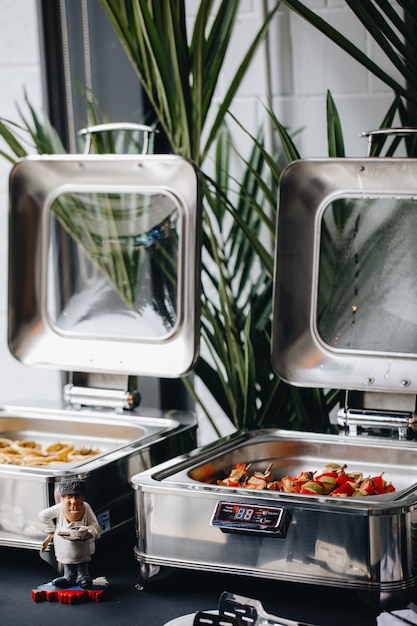 Beautifully decorated catering banquet table with different food snacks