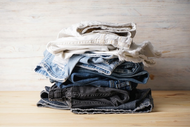 Premium Photo | Beauty and fashion, clothing concept - stack of jeans ...