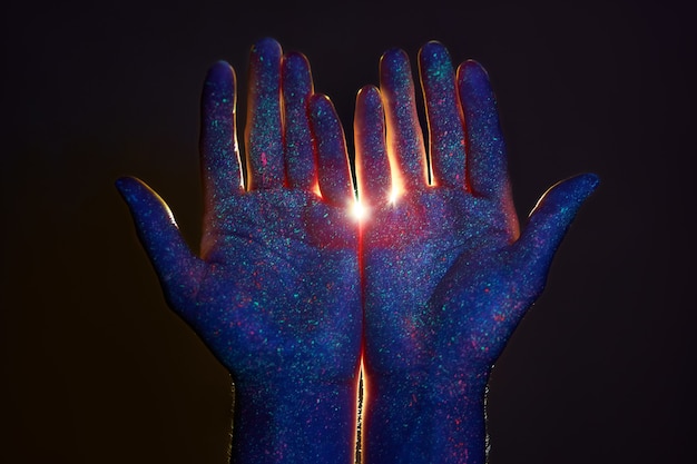 Premium Photo | Beauty hands in ultraviolet light in drops of colored ...