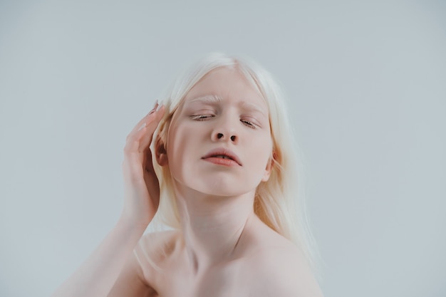 Premium Photo | Beauty image of an albino girl posing in studio wearing ...