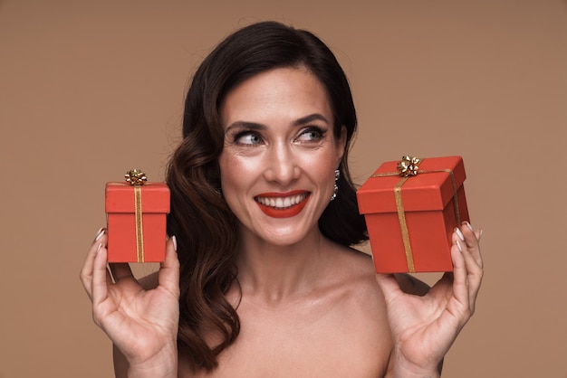 Premium Photo Beauty Portrait Of Happy Gorgeous Adult Half Naked Woman Holding Present Boxes