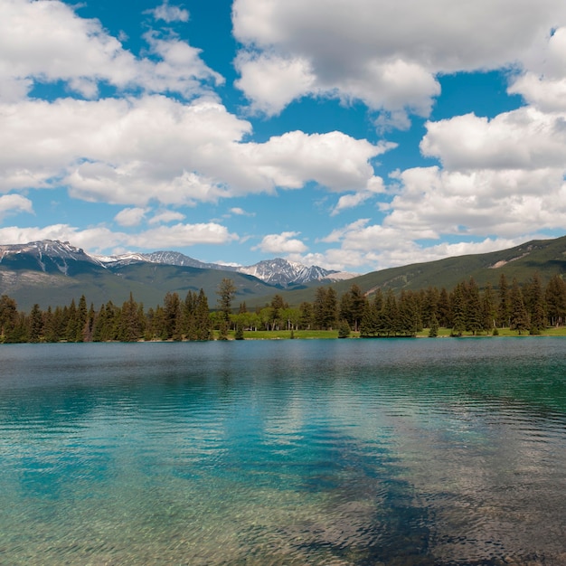 Premium Photo | Beauvert lake with mountains in the background, jasper ...