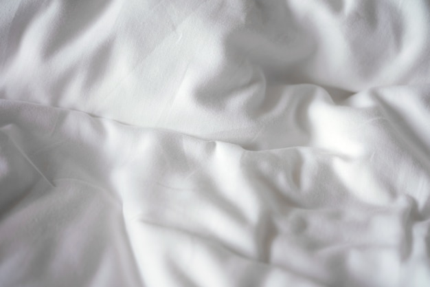 Premium Photo | Bed sheets soft white wrinkly texture background.