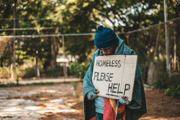 Free Photo | Beggars stand on the street with homeless messages please ...