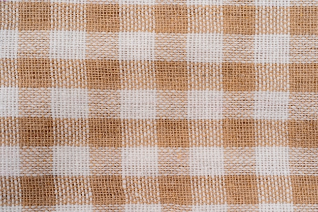 Premium Photo | Beige and white checkered fabric as background texture