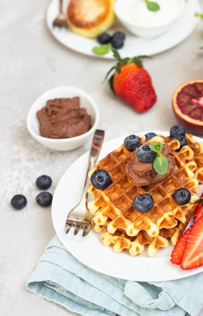 Belgian Waffles With Chocolate Sauce Berries Mint And Cottage