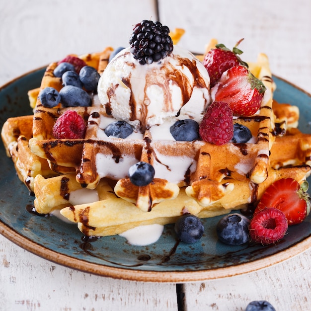 Premium Photo | Belgian waffles with ice cream,fresh berries