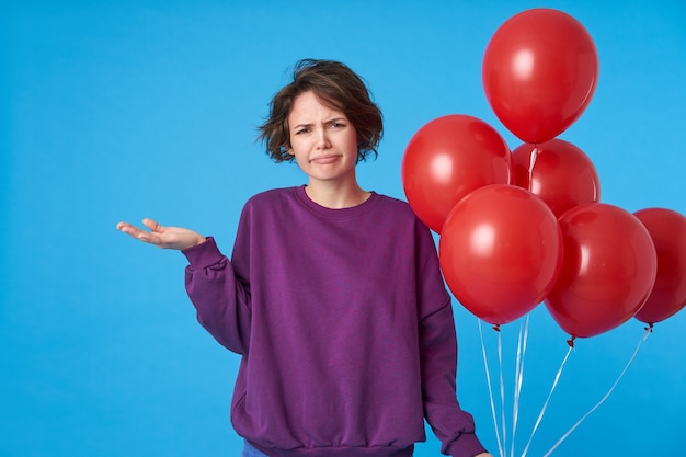 Free Photo Bewildered Young Short Haired Brunette Female Raising