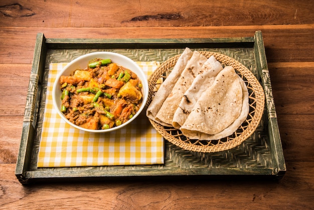 Premium Photo | Bhindi Masala Or Ladies Finger Fry And Mixed Veg In Red ...