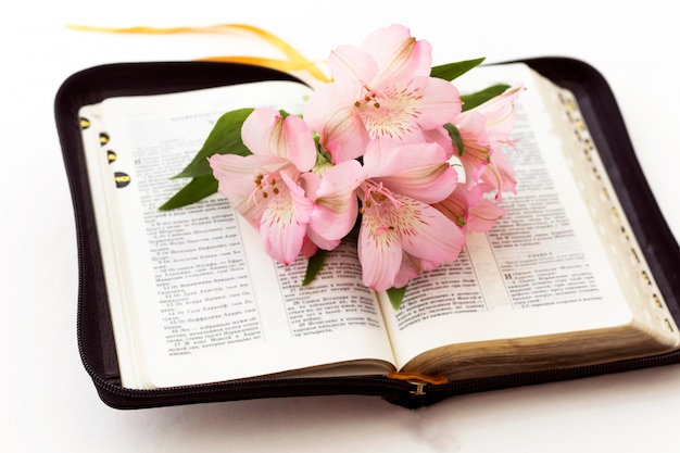 Premium Photo Bible And Flowers On White Background