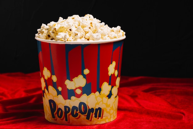 Big bucket of delicious popcorn | Free Photo