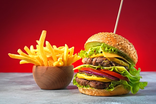Big hamburger with double beef and french fries Premium Photo