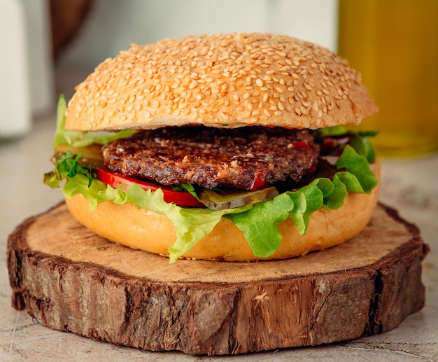 Free Photo | Big meat burger on wooden board