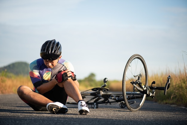 premium-photo-bike-injuries-man-cyclist-fell-off-road-bike-while