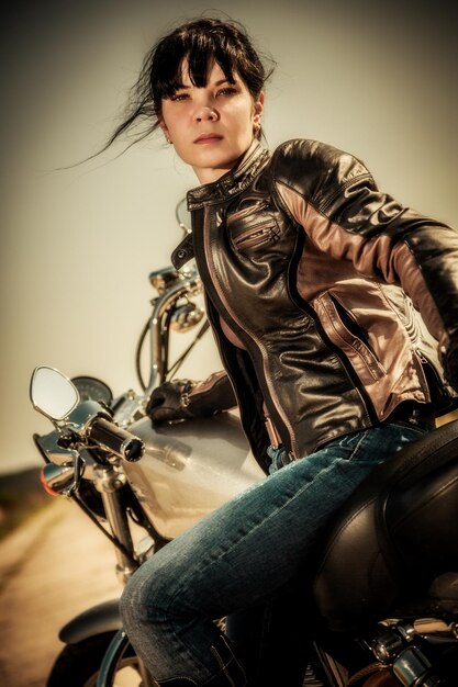 Premium Photo Biker Girl Sits On A Motorcycle 4579