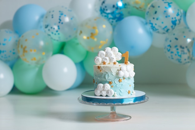 Premium Photo | Birthday cake with candles and balloons