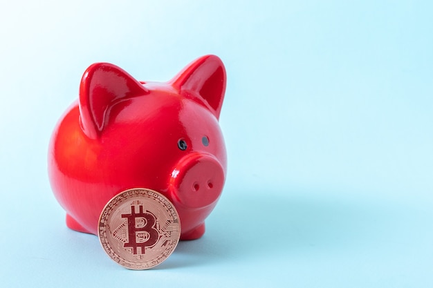 Premium Photo Bitcoin Coin And Red Piggy Bank On A Blue Background Close Up Copy Space Cryptocurrency Saving Concept New Virtual Electronic And Digital Money