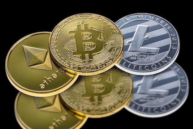 Bitcoin, ethereum and litecoin coins isolated on black with reflection. Photo | Premium Download