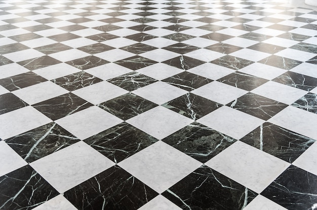 黒と白の市松模様の大理石の床 プレミアム写真