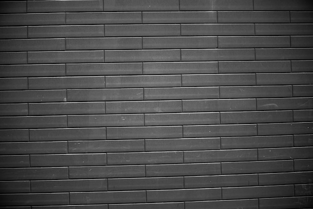 黒レンガの壁 アーバンブラックレンガ壁テクスチャ石積みの背景 プレミアム写真