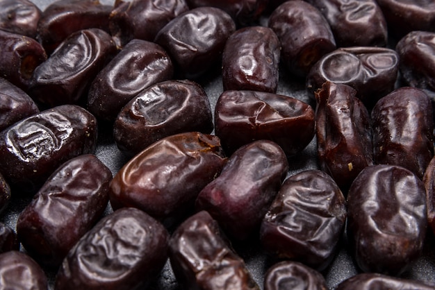 Black dates healthy dried fruits Premium Photo