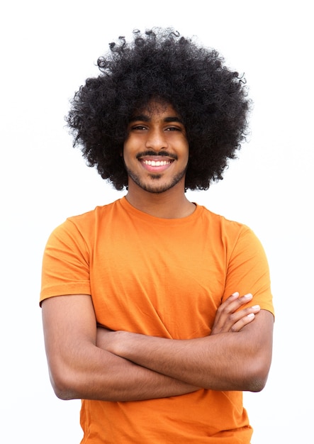 Black Guy Smiling With Arms Crossed Against White Background