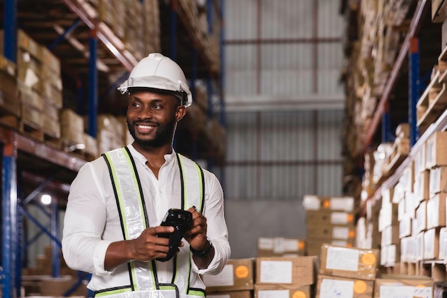 Premium Photo | Black male staff using digital barcode scanner working ...