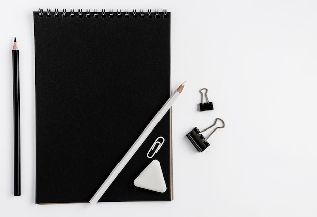 Download Premium Photo | Black notebook blank mockup, pencils and ...