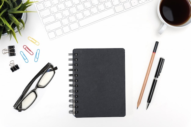 Black notebook on white desk table background with copy space Free Photo