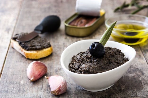 Premium Photo | Black olive tapenade with anchovies, garlic and olive ...