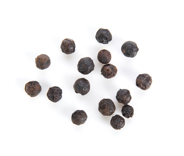 Premium Photo | Black peppercorns on white background