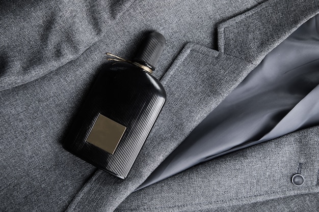 Premium Photo | Black perfume on a men's suit