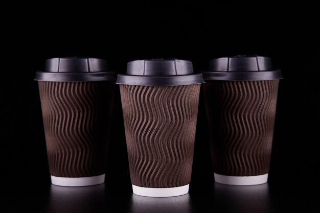 Premium Photo | Black space takeaway three coffee cups. coffee to go ...