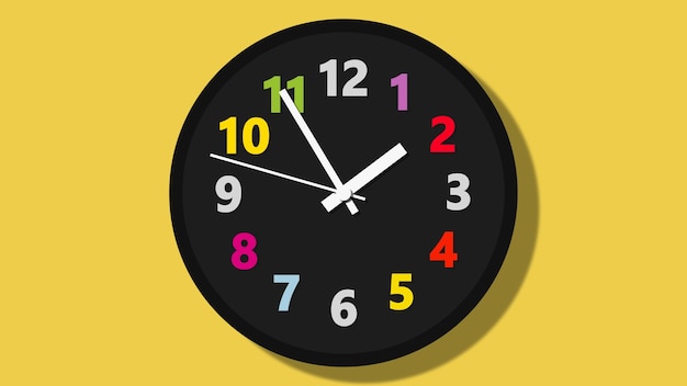 Premium Photo | Black wall clock with colorful numbers on yellow background