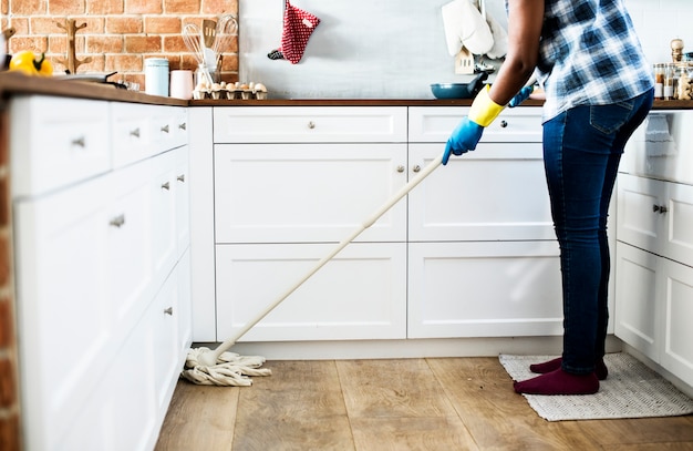 Black woman doing house chores | Free Photo