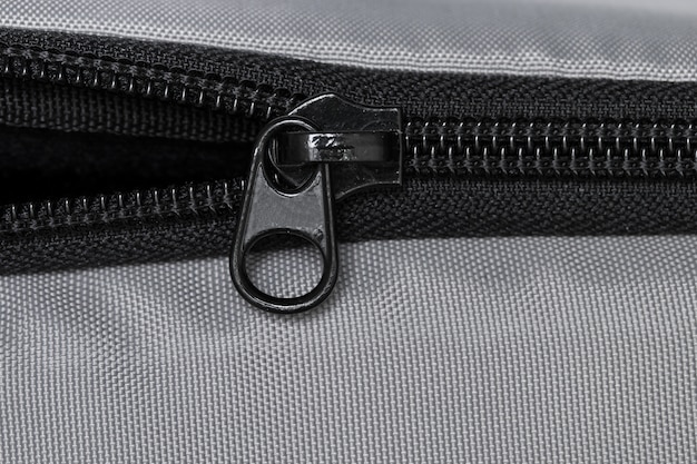 Premium Photo | Black zipper on a gray cloth.