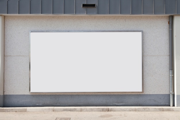 Premium Photo | Blank advertising billboard on concrete wall