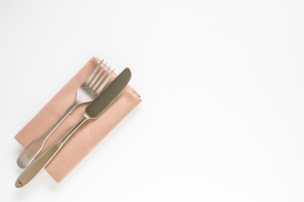 Download Blank brown restaurant napkin mockup with knife and fork | Premium Photo