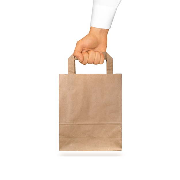 Download Premium Photo | Blank craft paper bag mock up holding in hand