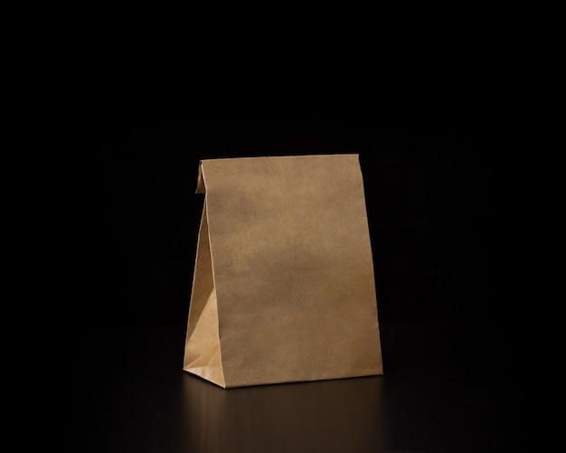 Download Premium Photo Blank Craft Paper Bag On Wooden Background Responsive Design Mockup PSD Mockup Templates