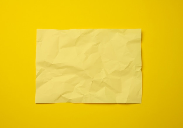 Premium Photo | Blank crumpled yellow sheet of paper, copy space. a4 format