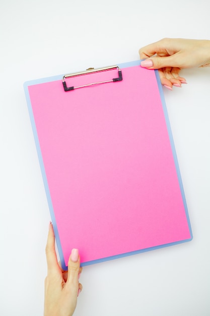 Premium Photo | Blank folder with pink paper, hand that holding folder ...