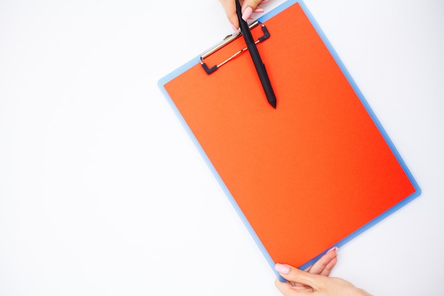 Premium Photo | Blank folder with range paper. hand that holding folder ...