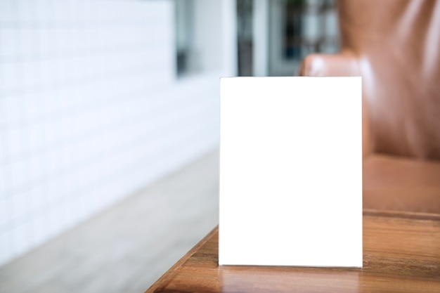 Blank menu frame on table in coffee shop stand for your text of display Premium Photo