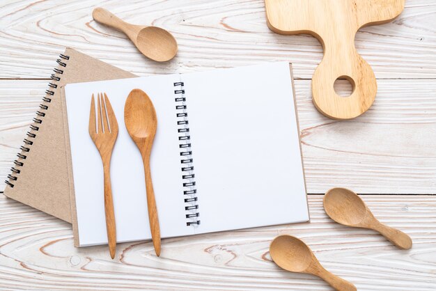 Blank notebook for text note on wooden surface with copy sapce Premium Photo